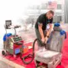 Demonstration of Contigo Pro Steamer cleaning a car seat at a trade show