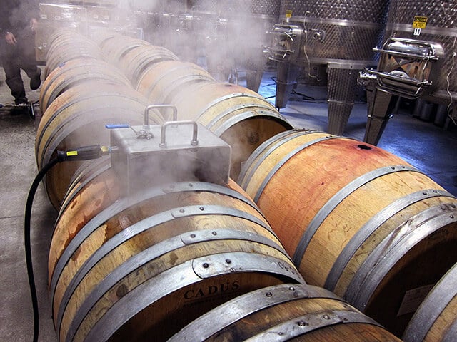 Optima SE-II using steam and barrel-steaming tool at a winery