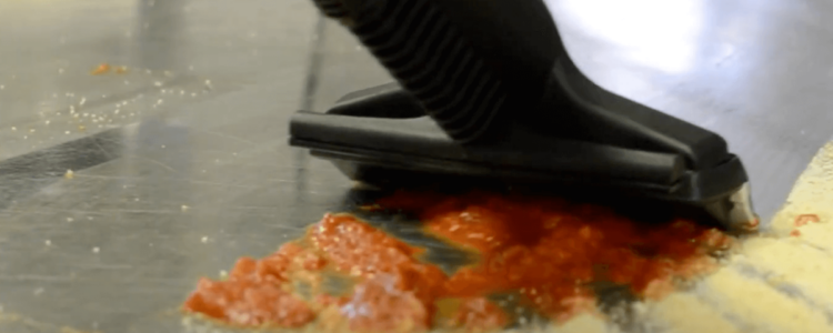 Contigo Pro Plus cleaning tomato sauce in a commercial kitchen